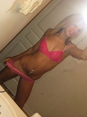 Here's a caption for you, fucker: This picture shows a hot-ass chick taking a dumbass selfie while she's got her tits all out in some pink lacey lingerie shit. Fuckin' A right!