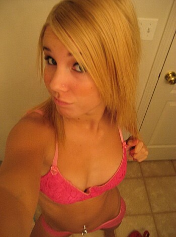 "Check out this fucking hot chick's massive tits poking through her tight pink bra. Damn, she looks good."