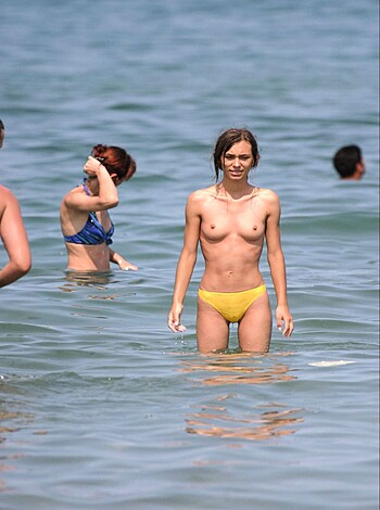 "Here's your tits-out chick in a barely-there thong, posing like the slutty surfer whore she is, her sun-kissed body just begging to be fucked by some lucky dude with an eye for hot bitches.
"