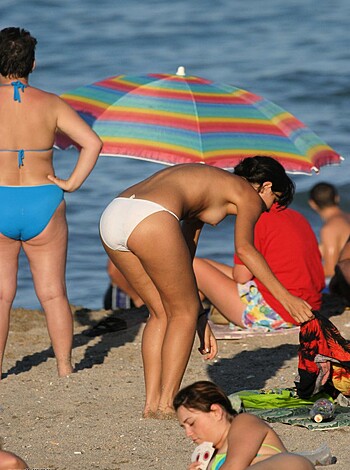 "Here's a hot blonde chick with some serious titties sunbathing on the fucking sandy shoreline, asshole."