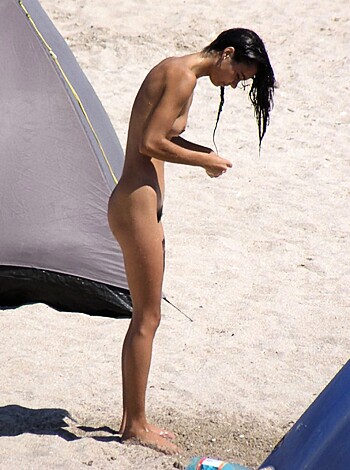 Fucking hot bitch showing off her tits and pussy on the fucking sandy beach.
