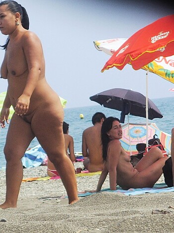 "Here's an uncensored look at a nude beach full of assorted chicks getting their kicks, spread eagle."