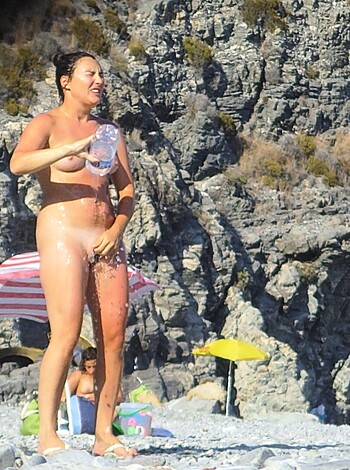 A fucking naked bitch at the shore.