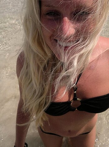 "Yo, check out this chick's hot ass in her skimpy-ass bikini while she's getting all sandy and shit on the fucking beach, brah."
