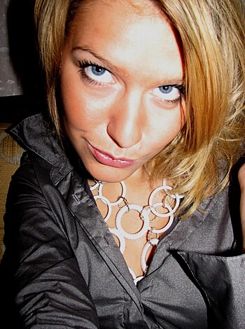 """
A fucking hot babe in a sexy leather coat and some sweet jewelry. 
"""