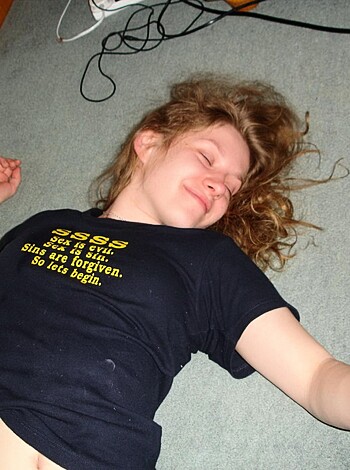 Vulgar Description: Look at this hot chick on the fucking floor with her tits out, bitch is smiling like she's got no goddamn worries in life.
