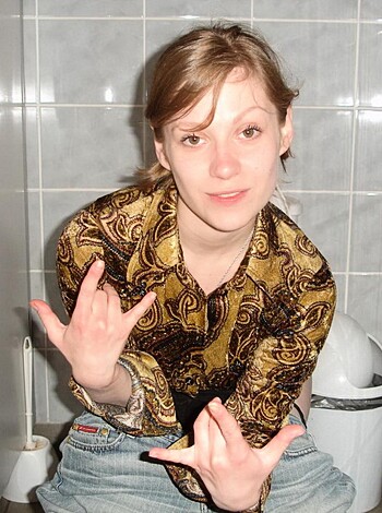 "Look at this fucking bitch, giving the finger while taking a shit."