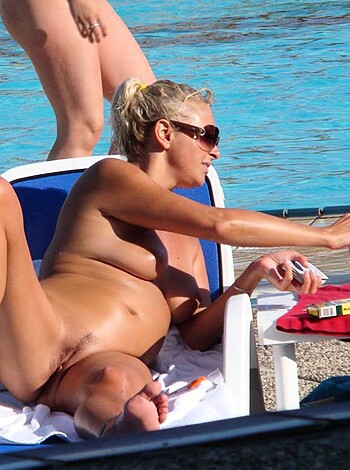 "Fucking hot chick busting out her titties while laying on a fluffy white towel at the goddamn swimming pool."