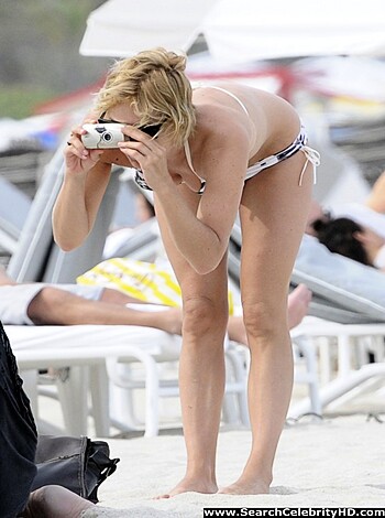 """
Hey bro, check out this fucking hot ass chick snapchatting her sexy tits and ass from the beach. Damn son, her swimsuit is looking tight as hell! She got a bangin body that's making me thirsty AF.
"""
