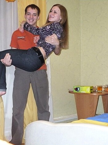 "Fucking dude hoists hot babe over his dick while chilling inside."