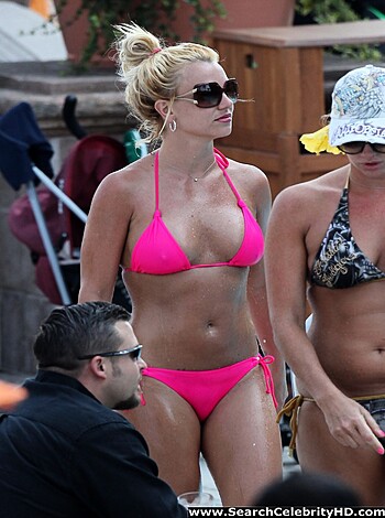 "Fucking hot chick in pink bikini and shades, lounging on a beach."