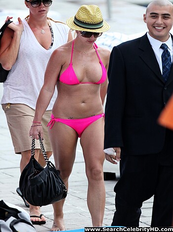 """
Check out this fucking hot chick in a tight pink bikini, strolling her ass down some tile shit, showing off her perfect tits and round ass. Fuck yea.
"""