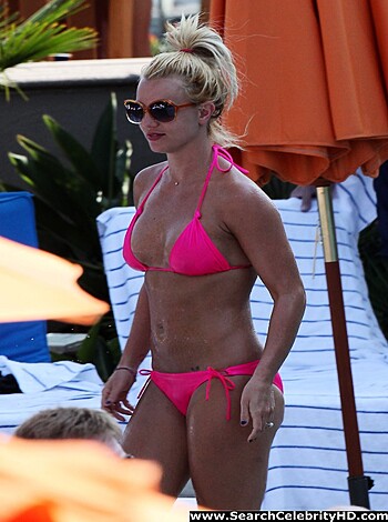 Tits and ass on display, blonde chick in pink thong.