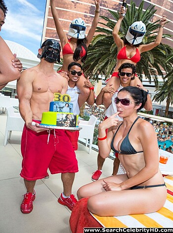 Vulgar Description: Fucking shitty people, some naked as fuck, celebrating ass-fucking birthday with goddamn cake and ice cream in their hands while others watch them like motherfuckers on the beach.