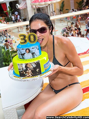 Here's the image of a hot slutty bitch, all dressed up in her tight-ass black bikini, holdin' some fucking candles and shit on top of a goddamn birthday cake, with a picture of that motherfucker she wants to bang plastered all over it.
