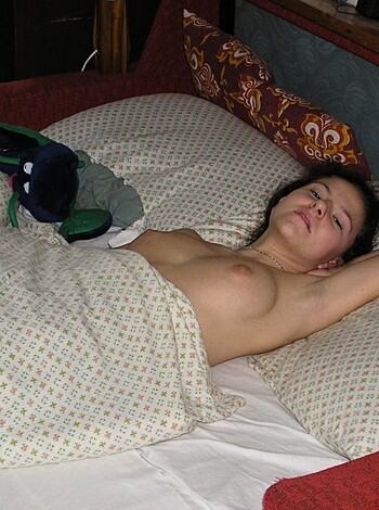 A fucking nude bitch lying on her back.