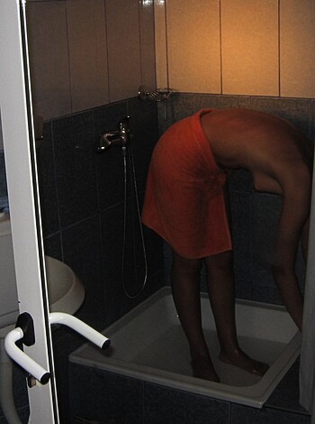 Vulgar description: This photo shows some dude jerking off in the shower.