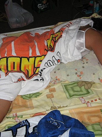 A fucking chick is passed out on a goddamn mattress.