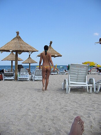 Fucking hot babe struts her tits and abs on a fucking gorgeous sandy shore, while not giving a single flying fuck about the judgmental pricks who dare to look.