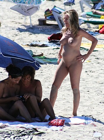 "Three naked broads lying on a fucking beach towel, one of 'em got a bikini on her ass. Bitch is walking up."