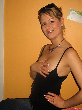 """
Chick in lingerie bending over to show off her ass.
""