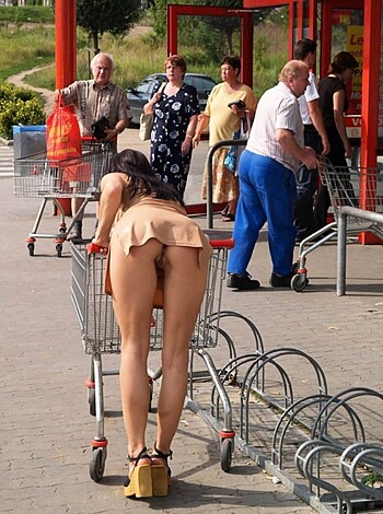 Here's the caption: A fat-assed cunt shoving a cart full of groceries with her ass.