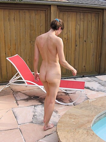 "Masturbating bitch outside pool. Behind fence."