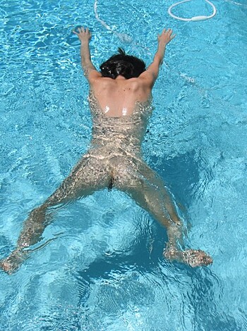 Here's a fucking hot shot of some dickless dude swimmin' naked as hell!