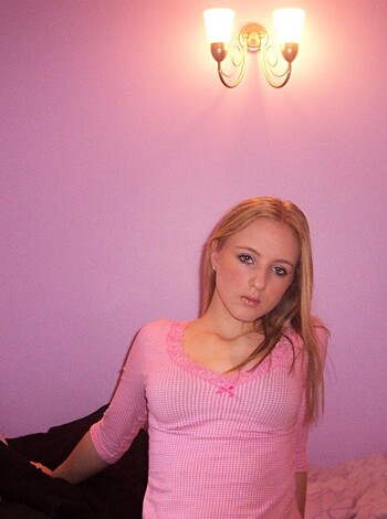 "Check out this fucking hot babe with her pink tits out for all to see, wearing a tight pink top, she's got the perfect rack and knows how to flaunt it."