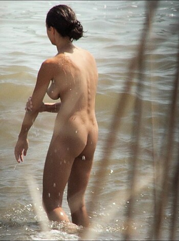 """
Hot ass nude chick wading into ocean, tits bouncing, pussy soaking wet.
"""