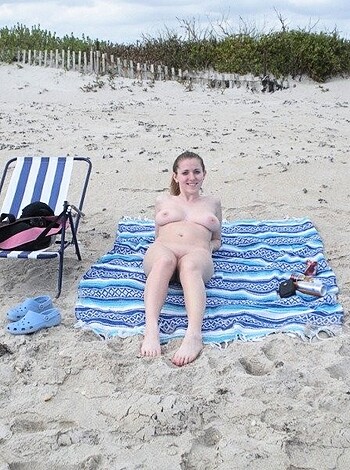 Vulgar description: "Fuckin' hot bitch sucks titties on sandy shore."