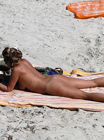 "Bitch chillin' on shore with her shirt off, smokin' some crack and readin' a fuckin' book."