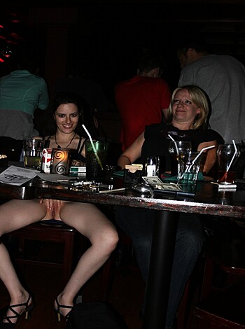 Vulgar description: Two chicks drinking wine with their gorgeous legs and hot feet exposed, one sitting on each side of the table like bitches.