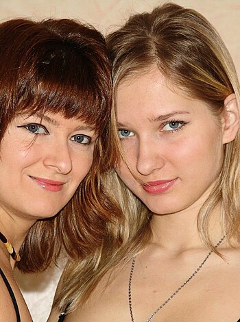 "Hot chicks with tits and shit, both rocking some bling."