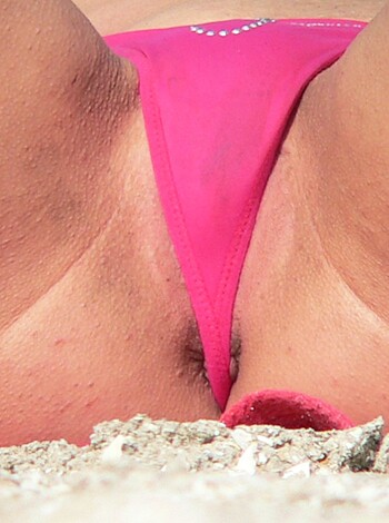 "This image is an up-close view of a chewed-up, sweaty, stained pink thong with fucking pubic hairs sticking out of it that someone wore before throwing it carelessly on the floor.