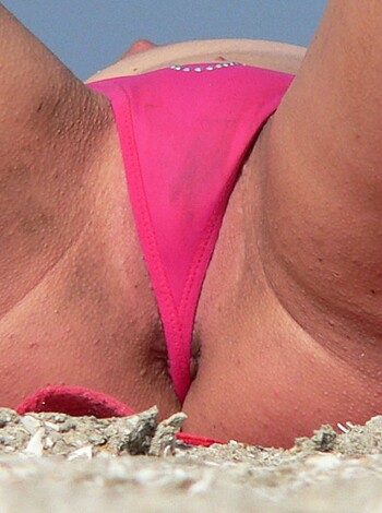 Vulgar description: This is a clear shot of some bitch's crack, with her panties pulled down far enough to show off her ass cleavage.