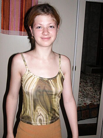 A young, barely dressed whore with skimpy clothes on.