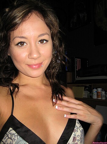 The chick's got her titties all hanging out in some lacy bra shit.