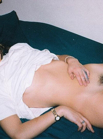 "Fucking hell, check out this fuckable babe getting fucked by that massive dong while she's lying nude on that ass-fucking bed. Dicks out for this hot piece of pussy."