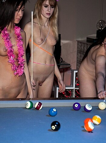 """
Several topless women with giant pool balls covering their boobs, snuggling up against each other while taking a group photo.
"""