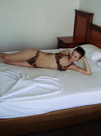 This bitch is fucking nude on some goddamn bed.