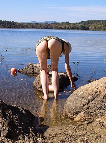 The old biddy's pissing in the stream for a shower!