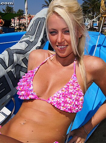 "Here's a hot, busty blonde babe in a tight pink bikini flaunting her perky tits and juicy ass on the fucking beach."