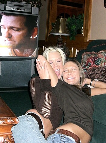 "Two horny broads making out and clutchin' up on the couch."