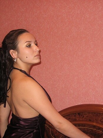 Vulgar description: "Here's a fat fuckin' slut in a black dress, takin' a selfie with her big titties shakin' out of that tight shit."
