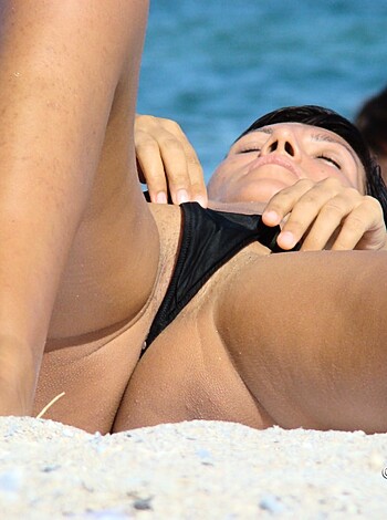 "Take a gander at this shit. This beached whale has her ass in the air while her pussy shows through her skimpy bikini bottoms. Fucking hot."