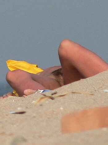 This bitch is getting her tits roasted in the sun while lying flat-chested on some goddamn sandy shore, for Christ's sake!