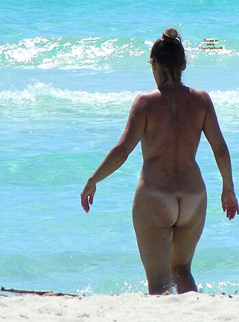 "Here's a naked bitch on the sandy shore with her dangling tits flapping like fucking seagull wings while she struts toplessly, like motherfucking hell!"