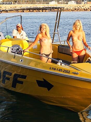 "Here's a fucking image of two titty bitches on a goddamn boat with some douche in a white hat driving the shit outta it."