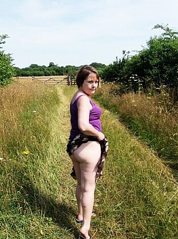 "Here's a photo of some hot ass bitch with her perfect round cheeks staring straight at the camera, just begging to get fucked."